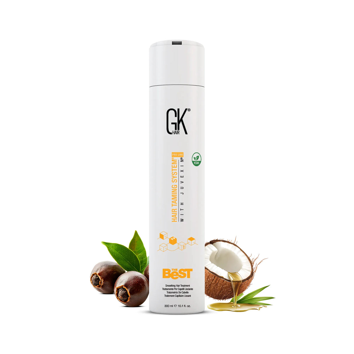 GK Hair The Best Smoothing Hair Treatment 300 ml white bottle beside jojoba nuts, green leaves and a coconut pouring oil