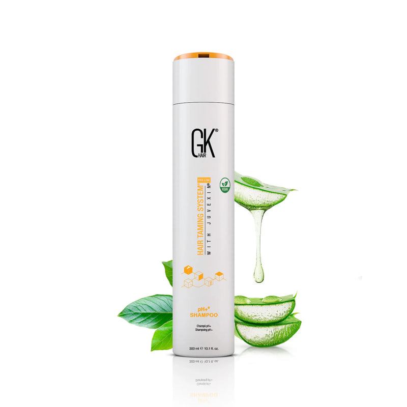 GK Hair pH+ Shampoo 300 ml white bottle with orange cap, aloe vera leaves and dripping gel beside it