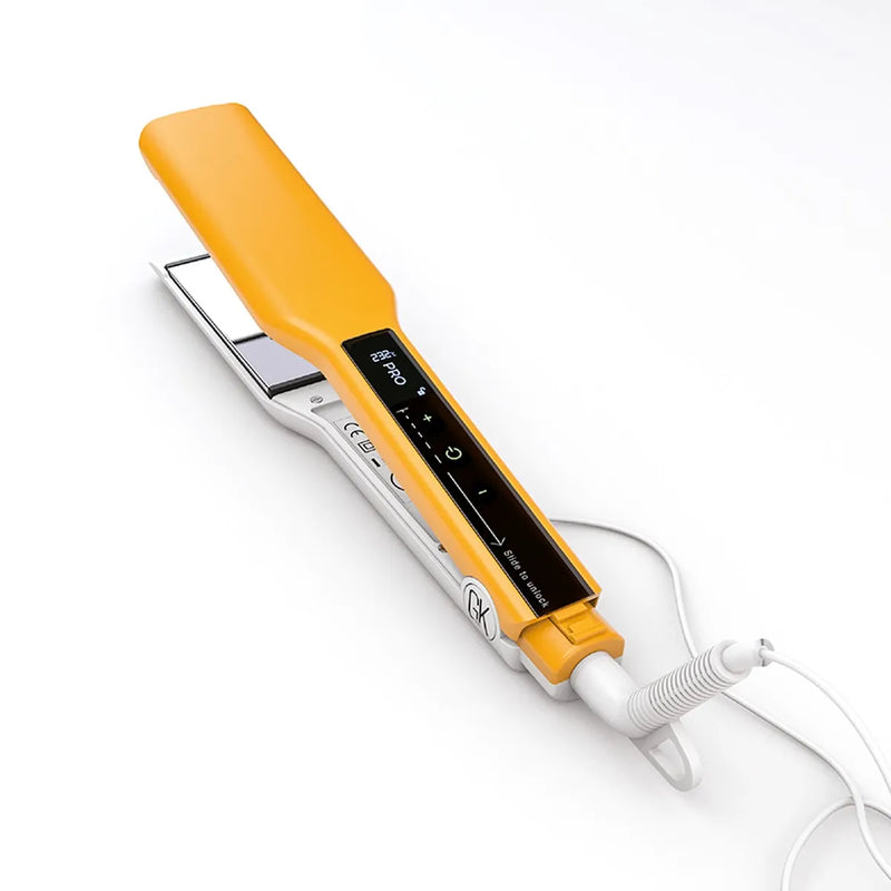 GK Hair Easy Control Titanium Flat Iron in yellow and white, touch display reading slide to unlock, cord coiled on white