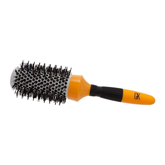 GK Hair Round Brush 43mm on its side, vented barrel with black bristles and an orange handle with a black ribbed grip