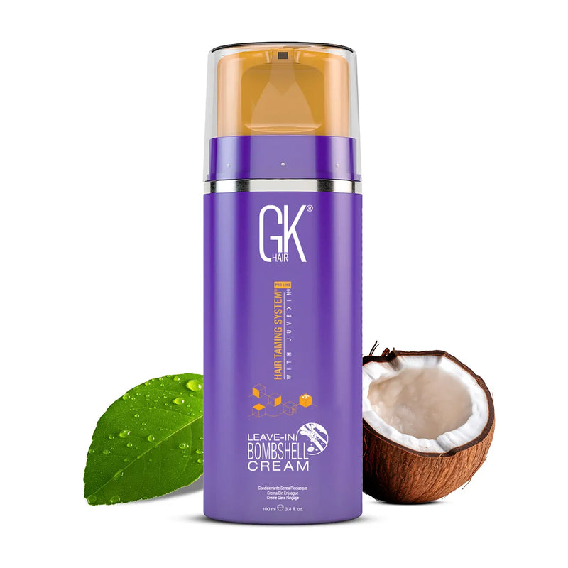 GK Hair Leave-In Bombshell Cream purple 100 ml pump bottle beside a green leaf and half a coconut on a white background