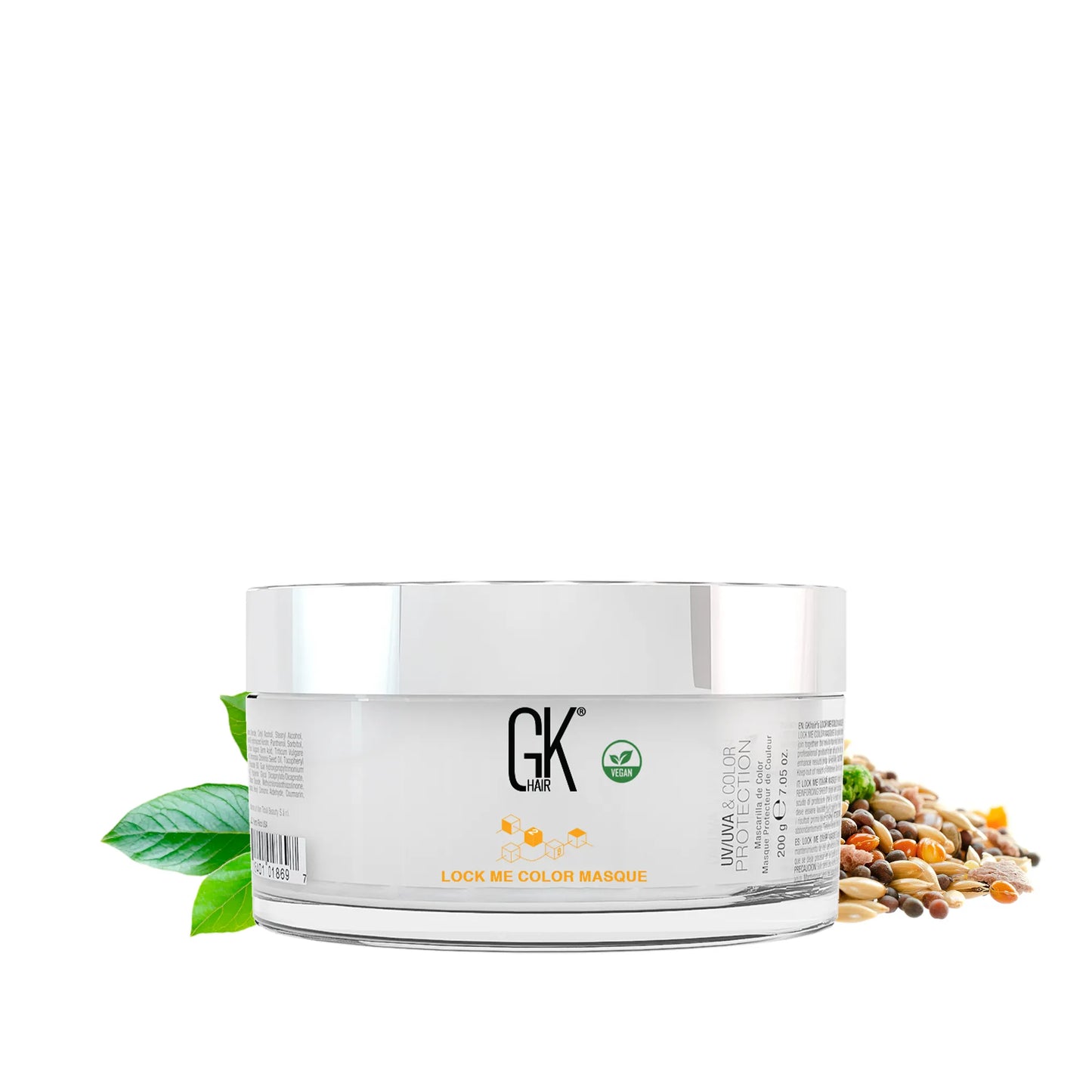 GK Hair Lock Me Color Masque 200 g jar with silver lid, UV/UVA and Color Protection label, beside green leaves and seeds