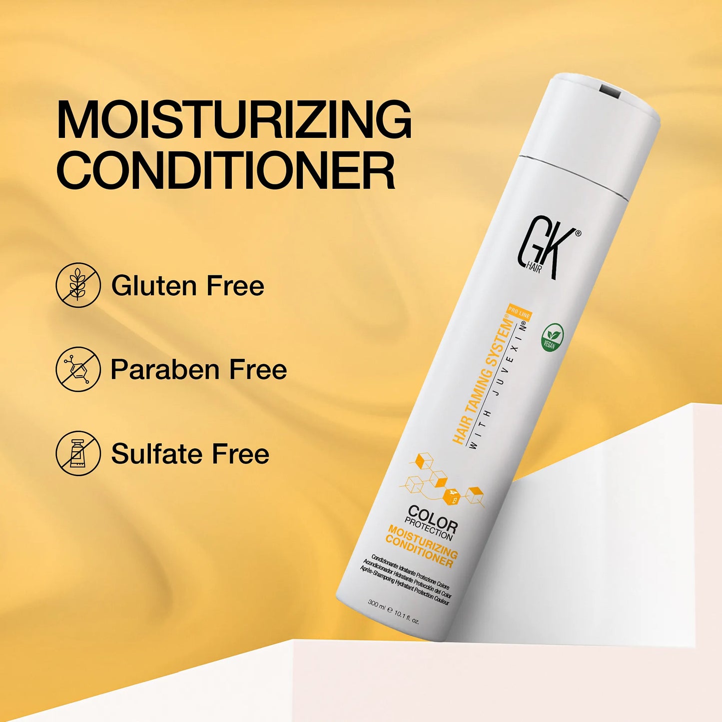 A bottle of moisturizing conditioner with labels indicating it is gluten-free, paraben-free, and sulfate-free, set against a yellow background.